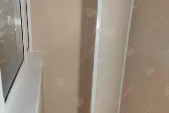 Обшивка балкона снаружи коричневым профнастилом