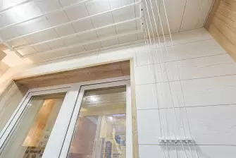 Отделка ламинатом Г-образного балкона с утеплением